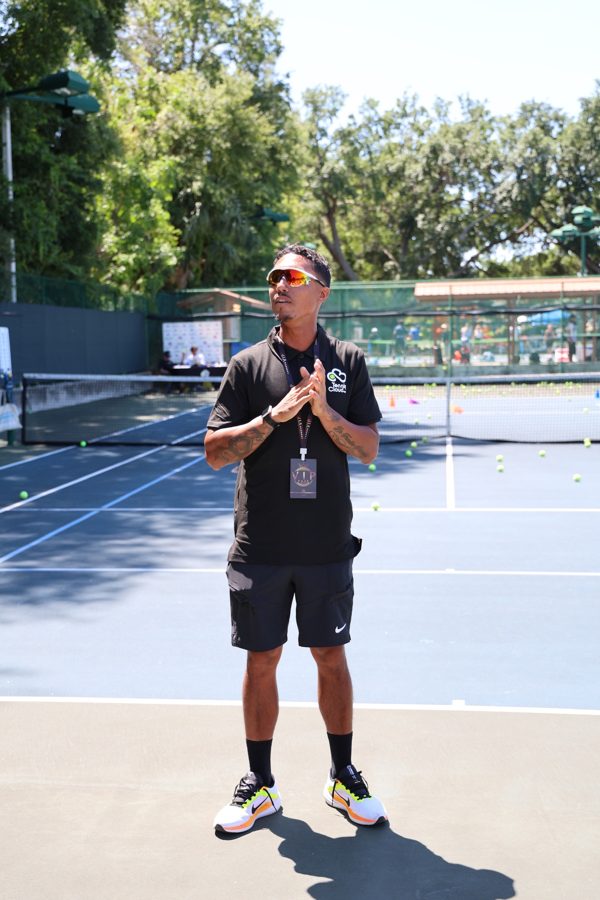 Coach Liam on court at the start of a clinic