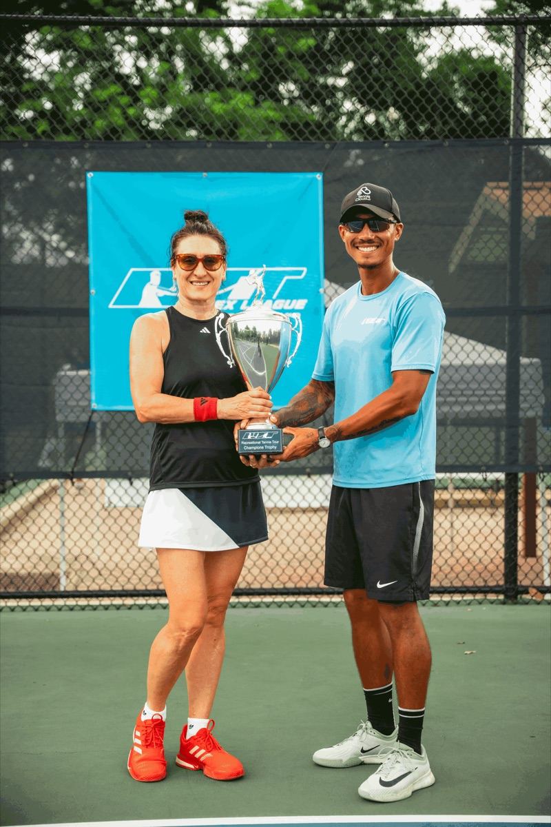 Sanja and Coach Liam holding the RTT League Champions Trophy on court